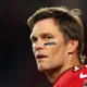 Tom Brady looking to the side with a blank stare